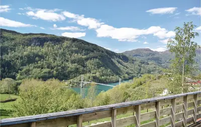 a view of a valley with a river and mountains at 4 Bedroom Beautiful Home In Steinstø in Steinstø
