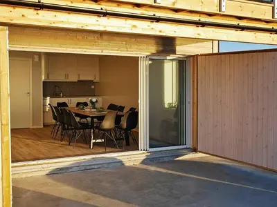 a view of a dining room and kitchen from inside a house at 10 person holiday home in Brattvåg in Brattvåg