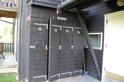 a pair of garage doors on the side of a house at Hafjell Alpinlandsby Pluss in Hafjell