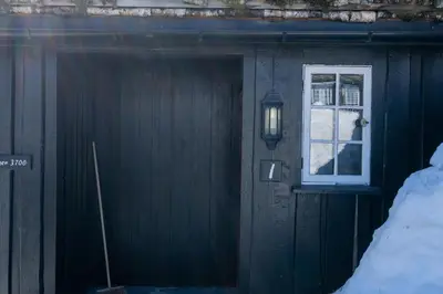 a door to a house with a window on it at Bitigrenda I in Beitostøl