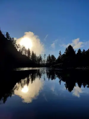 a view of a lake with a cloud in the sky at Waerholmen in Lavik