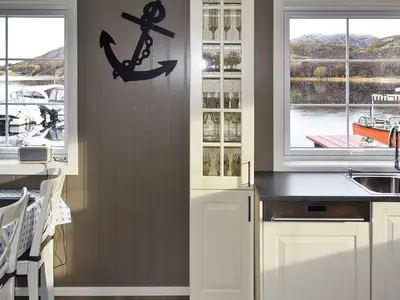a kitchen with a sink and an anchor on the wall at 6 person holiday home in Oksvoll in Oksvoll