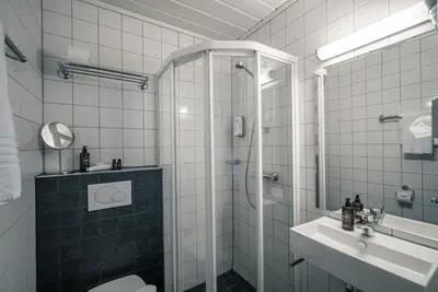 a bathroom with a shower and a sink at Sagafjord Hotel - by Classic Norway Hotels in Sæbø