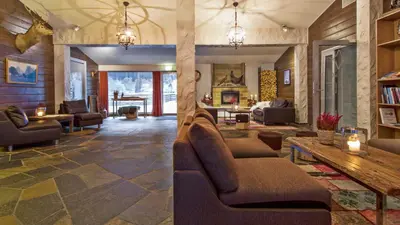 a large living room with couches and a fireplace at Sagafjord Hotel - by Classic Norway Hotels in Sæbø