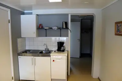 a small kitchen with a sink and a counter at Jostedal Hotel in Jostedal