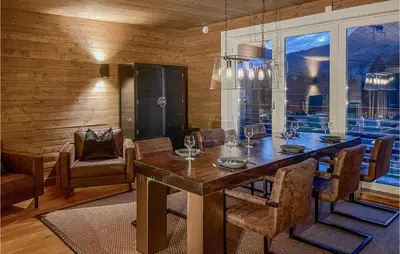 a dining room with a table and some chairs at 5 Bedroom Cozy Home In Hemsedal in Hemsedal