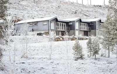 a large house in a field with snow on the ground at 5 Bedroom Cozy Home In Hemsedal in Hemsedal