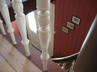 a group of white stairs with a red wall at Hagaled Gjestegård in Nesbyen