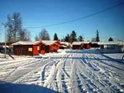 a snow covered road with footprints in the snow at Kvanhøgd Turistsenter in Gol