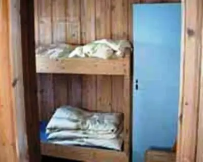 a room with a bunk bed in a room at Kvanhøgd Turistsenter in Gol