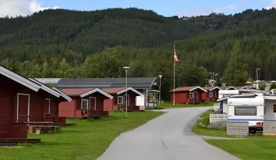 a village of houses and a road with a mountain at First Camp Gol Hallingdal in Gol
