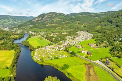 an aerial view of a town next to a river at First Camp Gol Hallingdal in Gol