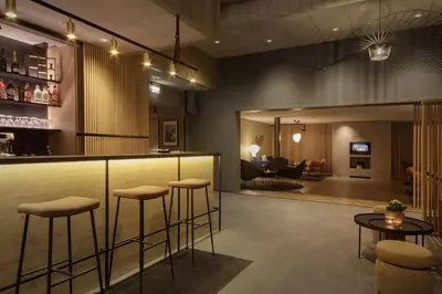 a lobby with a bar and a living room at Scandic Victoria Lillehammer in Lillehammer