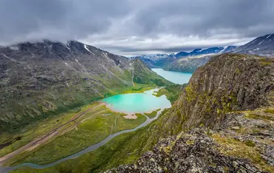 an aerial view of a mountain with a lake at Jotunheimen Husky Lodge in Randsverk