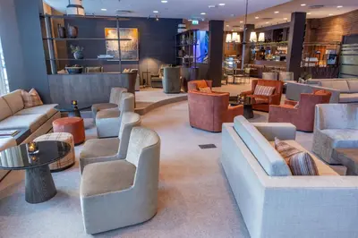 a lobby with couches and chairs and tables at Myrkdalen Resort Hotel in Myrkdalen