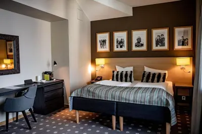 a hotel room with a bed and a desk at Myrkdalen Resort Hotel in Myrkdalen