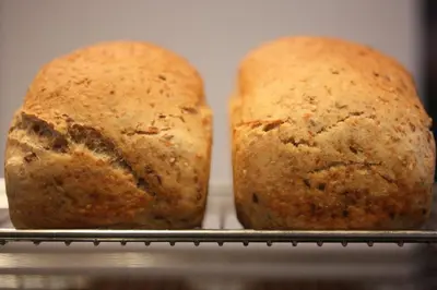two loaves of bread sitting on a rack at Almaas Hotell Stord AS in Stord