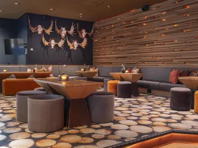 a restaurant with tables and couches in a room at Radisson Blu Resort, Trysil in Trysil