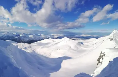a view of a snowy mountain range with snow covered mountains at Sunndalsfjord Cottages Fredsvik Meisalstranda 455,506 og 508 in Sunndalsøra
