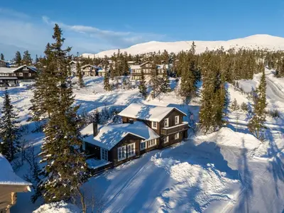 an aerial view of a home covered in snow at Sjumilskogen in Trysil