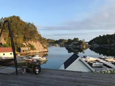a view of a river with boats in the water at Havbris in Bremnes
