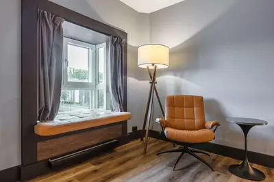 a room with a chair and a window at Radisson Blu Royal Garden Hotel, Trondheim in Trondheim
