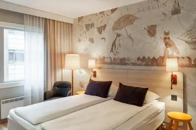 a bedroom with a bed and a wall with a mural at Scandic Kokstad in Bergen