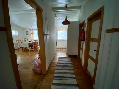 a hallway of a home with a dining room at Hakkesetstølen Hytter in Geilo