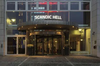 a building with a sign that reads senna hell at Scandic Hell in Hell
