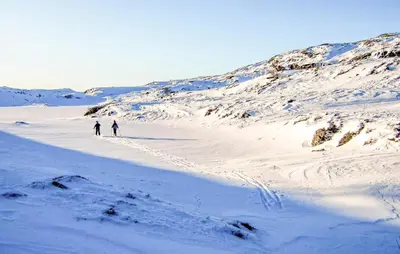 two people walking through a snow covered mountain at Amazing Home In Jøsenfjorden With Sauna in Gullingen