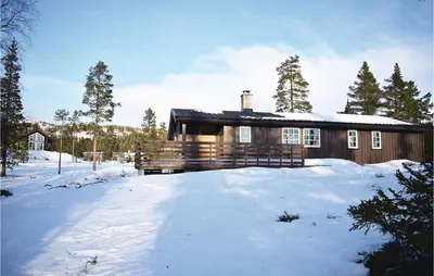 a house with snow in front of it at Four-Bedroom Holiday Home In Eggedal in Eggedal