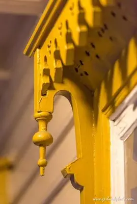 a close up of a yellow building with a window at Lindstrøm Hotel in Lærdalsøyri