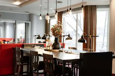 a dining room with a table and chairs at Scandic Kristiansund in Kristiansund