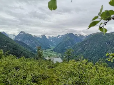 a view of a valley with a lake and mountains at Sogndal ski- and mountain cabin in Sogndal