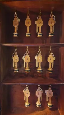 a wooden shelf filled with lots of brass things at Geilo Mountain Lodge in Geilo