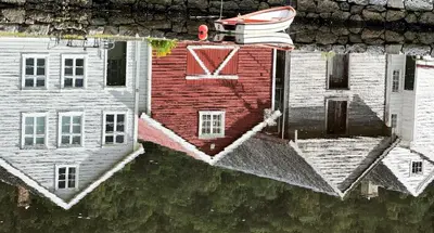 a reflection of a house in the water at Mjøsvang Kafe in Vang I Valdres