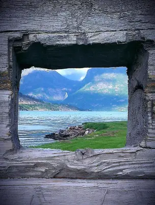 a view of a window in a piece of wood at Marifjøra Sjøbuer in Marifjora