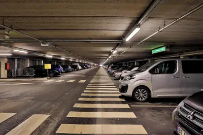 a parking garage with cars parked in it at Bergen's Best Location in Bergen