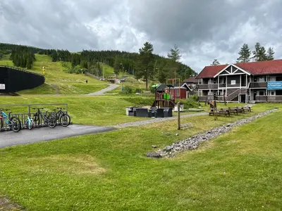 a group of bikes parked in front of a lodge at Trysilfjell Apartment Hotel in Trysil