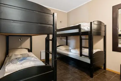 two sets of bunk beds in a room at Trysilfjell Apartment Hotel in Trysil