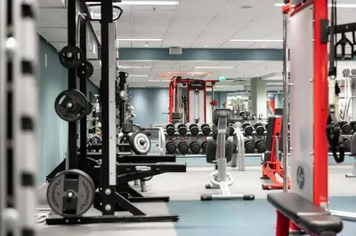 a gym with dumbbells and other equipment at Scandic Seilet Hotel in Molde