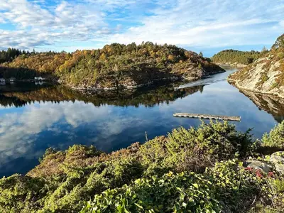 a river with trees on the sides of it at 6 person holiday home in Urangsvåg in Steinsbø