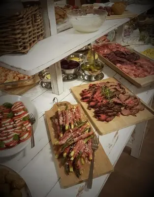 a table full of different types of food at Utvika Camping in Nes