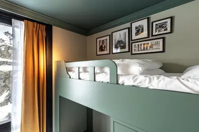 a bedroom with a bunk bed and a window at Fýri Resort in Hemsedal