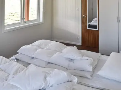 a group of white blankets sitting on the floor in a room at 10 person holiday home in skei i jølster in Årdal
