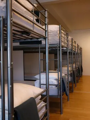 a row of bunk beds in a room at Blue House Dormitory in Odda