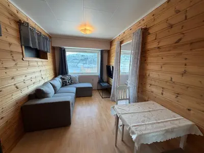 a living room with a couch and a table at Studio Apartment in Haukedalen in Førde
