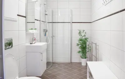 a white bathroom with a toilet and a sink at Stunning Apartment In Vossestrand in Vossestrand