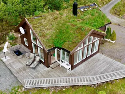 an overhead view of a house with a grass roof at Serene Waterfront Retreat-By Traum in Valevåg