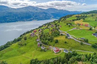 an aerial view of a village on a hill next to a lake at Modern Apartment with panorama wiew in Blakset